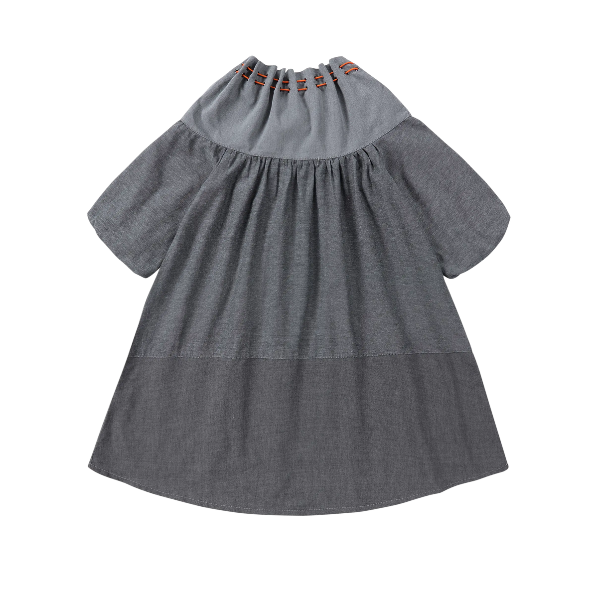 Back view of Puvu Pior® chambray dress, showcasing the gathered collar, two-tone colorblock panel, and high-low hem.
