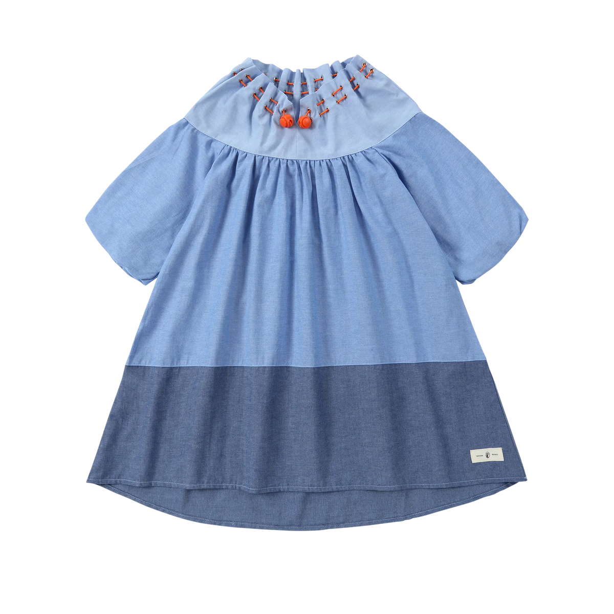 Puvu Pior® light blue chambray colorblock dress with gathered drawstring collar, orange toggles, and short sleeves.