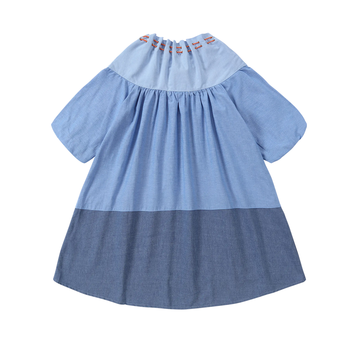 Back view of Puvu Pior® light chambray dress, showcasing the gathered collar, two-tone blue colorblock, and high-low hem.